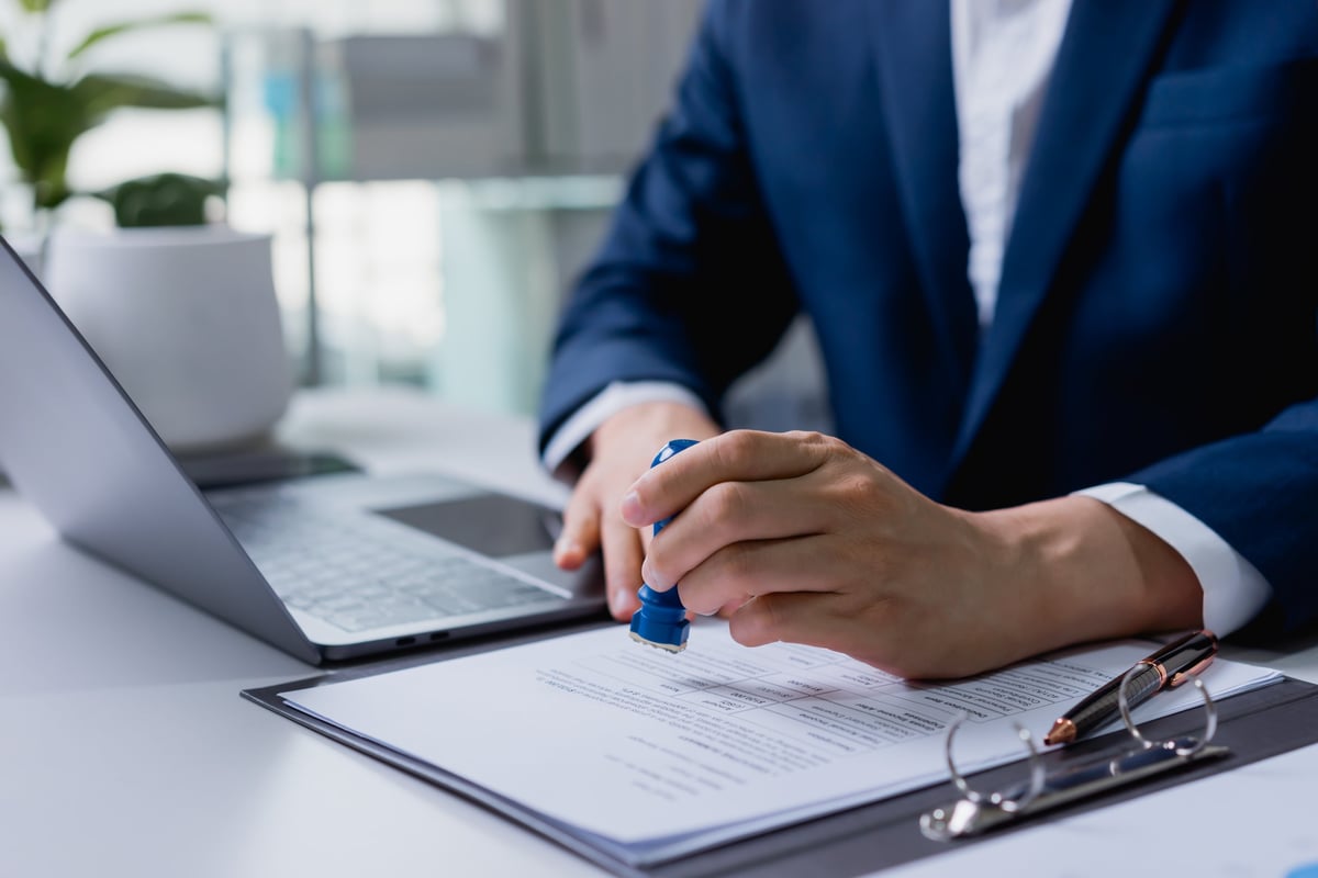 Notary stamping and approving an official document
